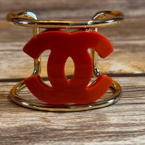 CHANEL Gold Bracelet with Red Accent